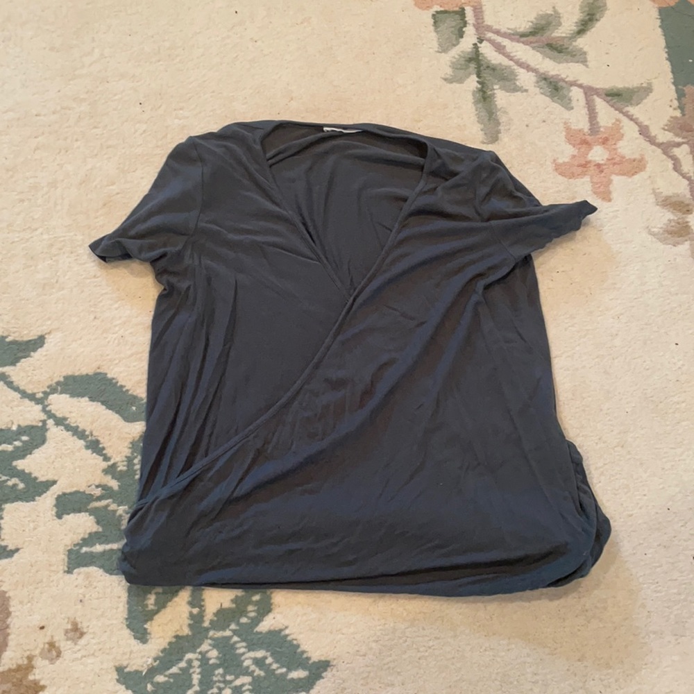 green shirt with a slit in the front